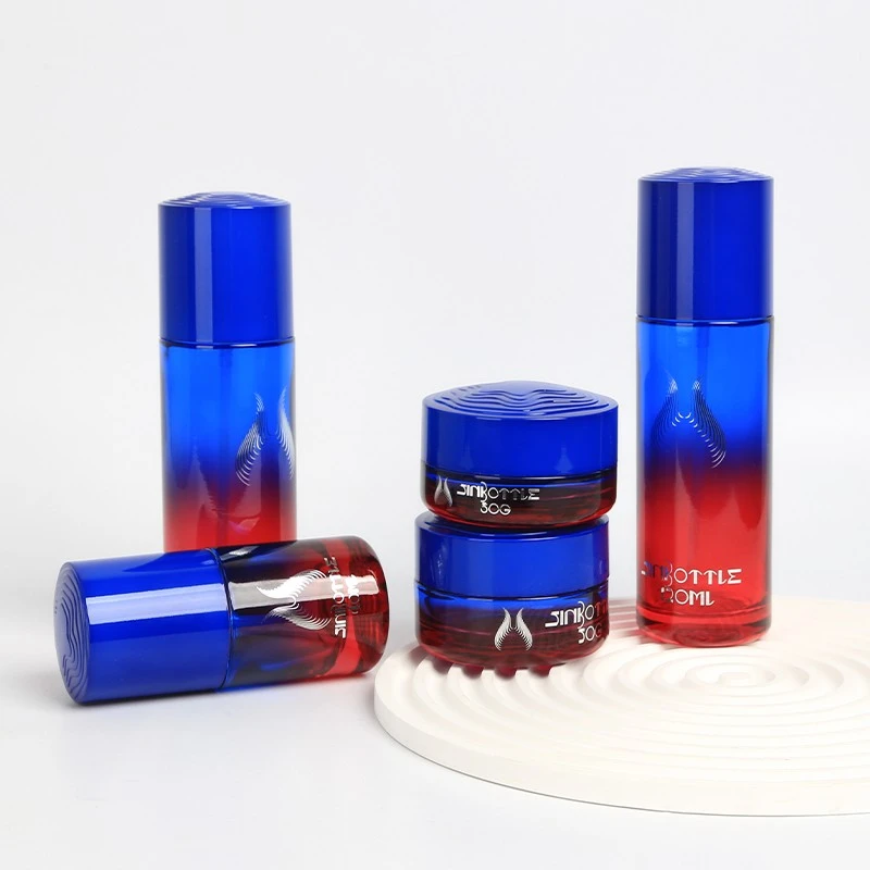 Custom Luxury Gradient Blue And Red Glass Cosmetic Packaging Set Lotion Bottle Cream Jar For High End Skincare Brands suppliers